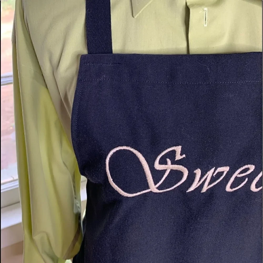 At Home with Susan Fleming personality apron “Sweet” black with tan thread